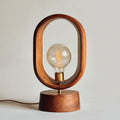 Marble table lamp with metal cage design and 20 x 20 x 40cm dimensions